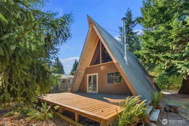 a aerial view of a house with a yard