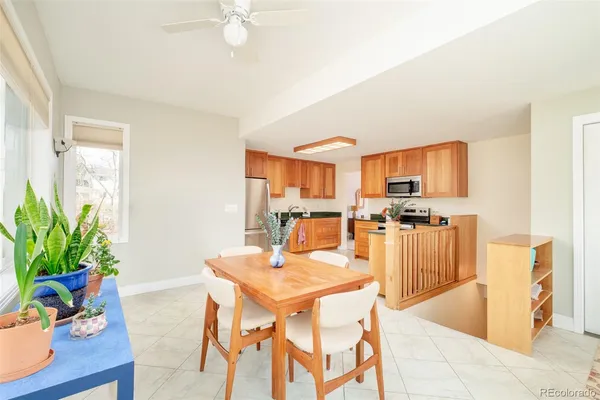 a dining room with furniture and a kitchen view