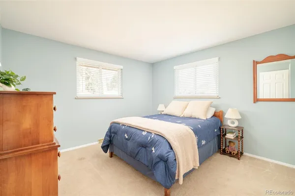 a bed room with a bed and a window