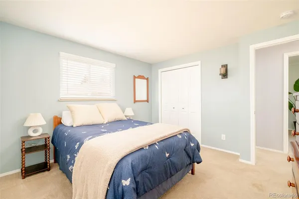 a bedroom with a bed and a cabinets