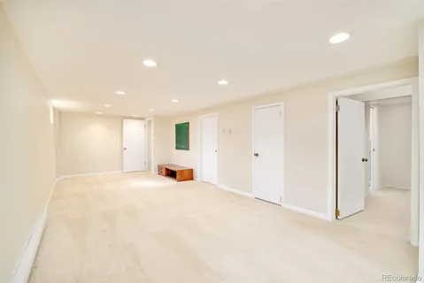 a view of an empty room with a fireplace