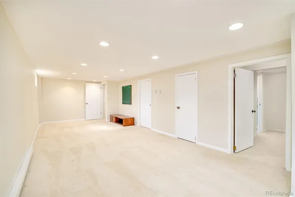 a view of an empty room with a fireplace
