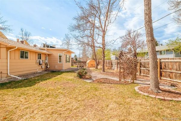 a view of a yard with snow on the road