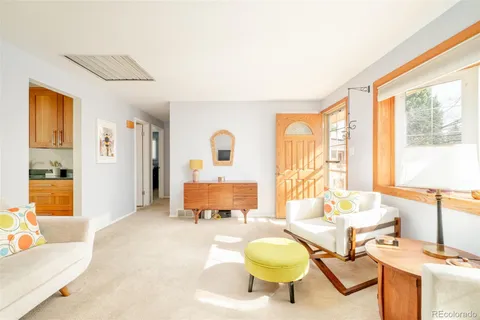 a living room with furniture and a table