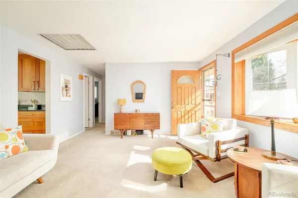 a living room with furniture and a table