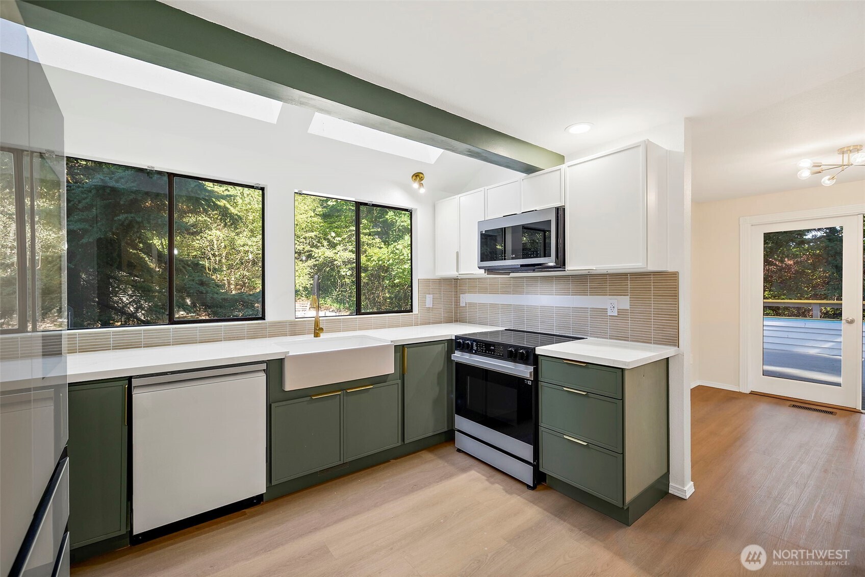 21911 4th Avenue Southeast Bothell, WA 98021 - Photo 11 of 28 a kitchen with a stove sink and microwave