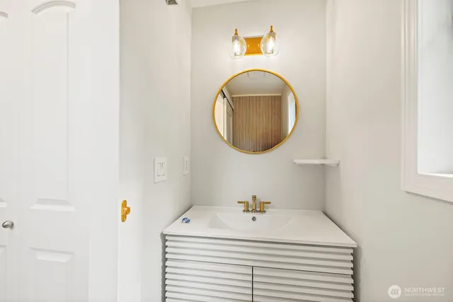 a bathroom with a sink and a mirror