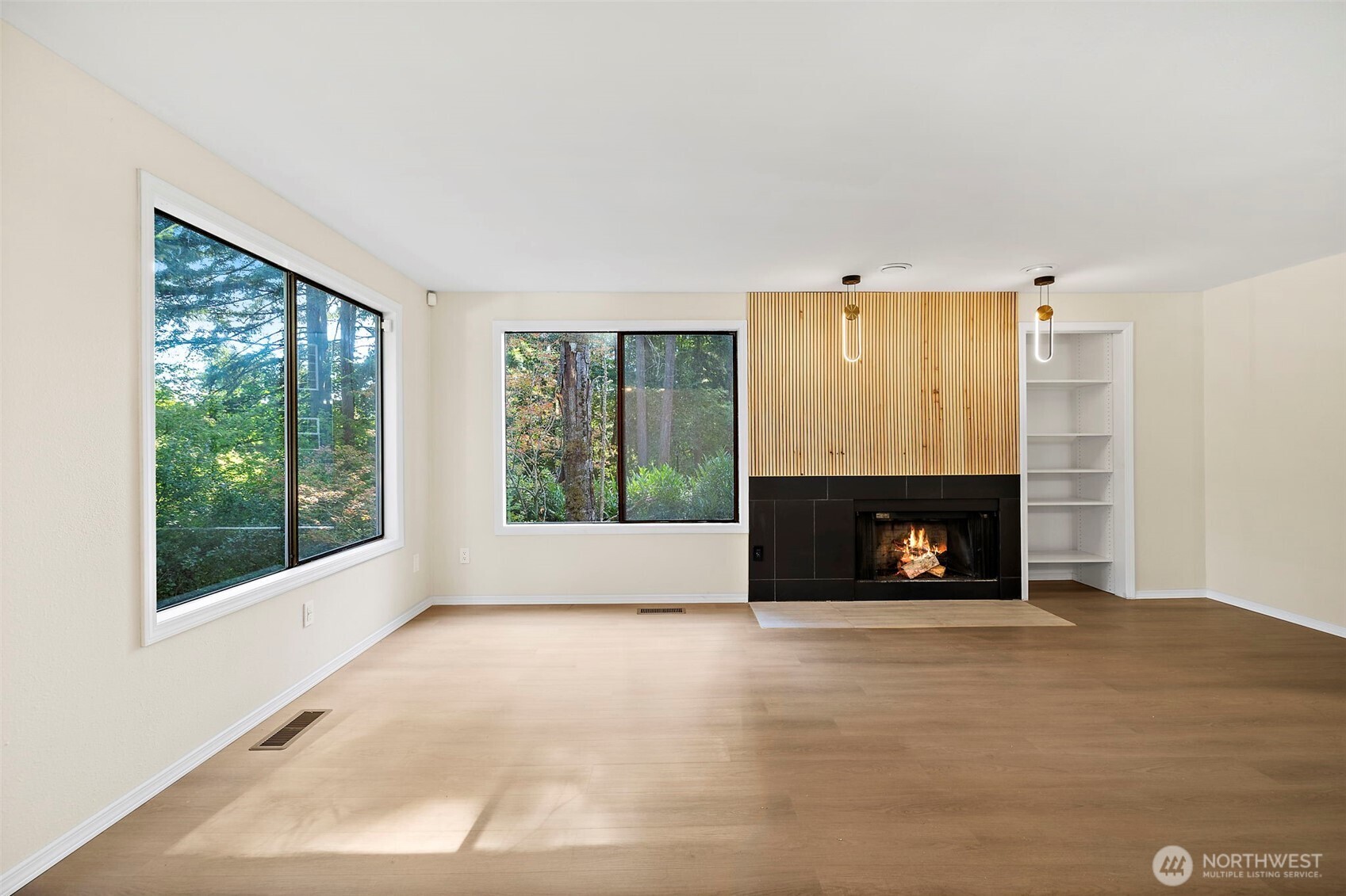 21911 4th Avenue Southeast Bothell, WA 98021 - Photo 4 of 28 a view of an empty room with a fireplace and a window