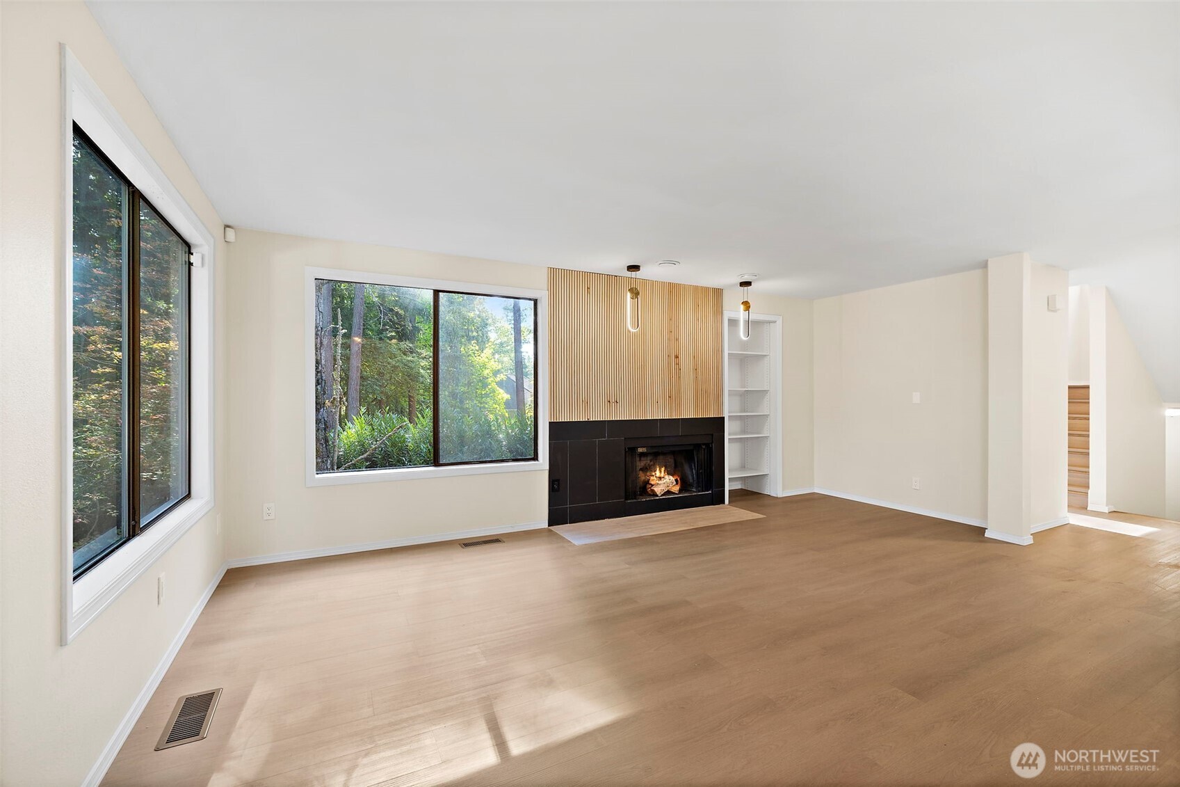 21911 4th Avenue Southeast Bothell, WA 98021 - Photo 5 of 28 a view of an empty room with a fireplace and a window