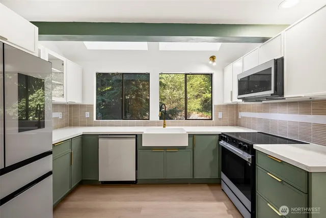 a kitchen with a sink and a stove top oven