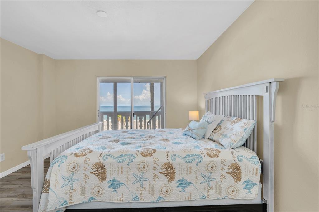 403 Gulf Way, Unit 302 St. Pete Beach, FL 33706 - Photo 13 of 30 a bedroom with a bed and a window