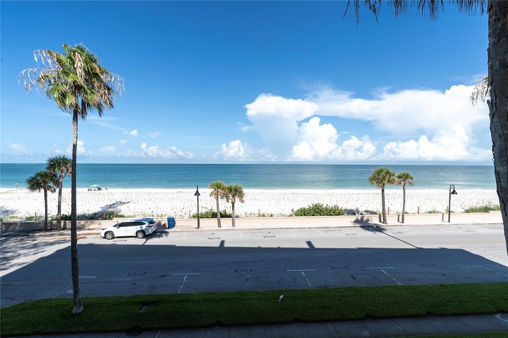 403 Gulf Way, Unit 302 St. Pete Beach, FL 33706 - Photo 20 of 30 a view of a yard and an ocean view