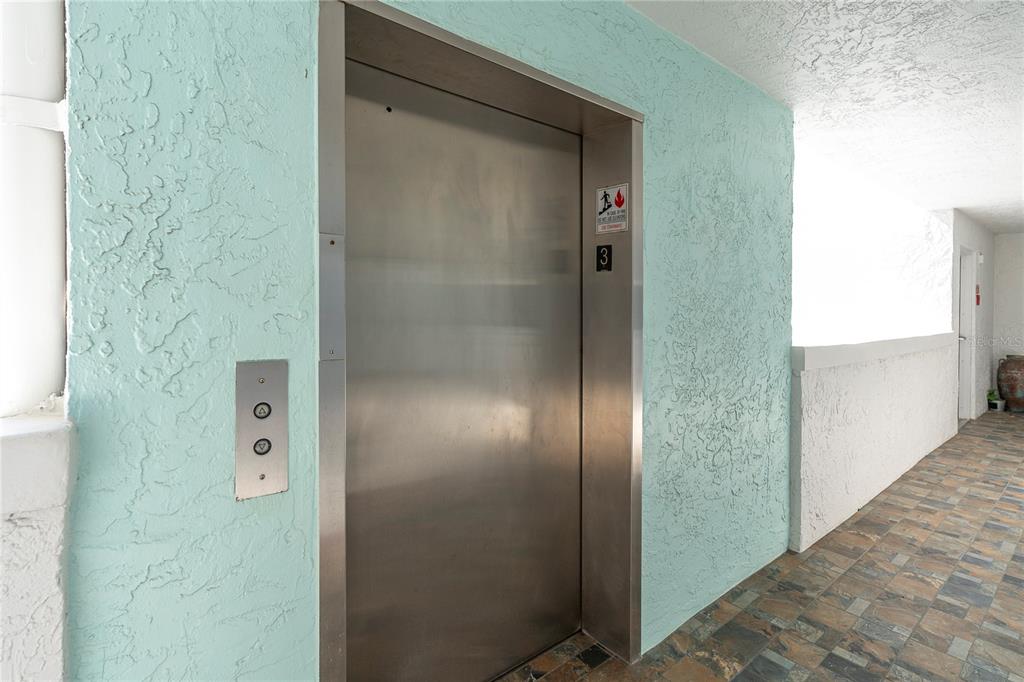 403 Gulf Way, Unit 302 St. Pete Beach, FL 33706 - Photo 27 of 30 a bathroom with a glass shower door