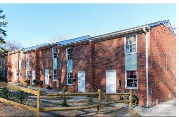 296 Hamilton Drive Northeast, Unit 9 Concord, NC 28025 - Photo 1 of 10 a front view of building with street view