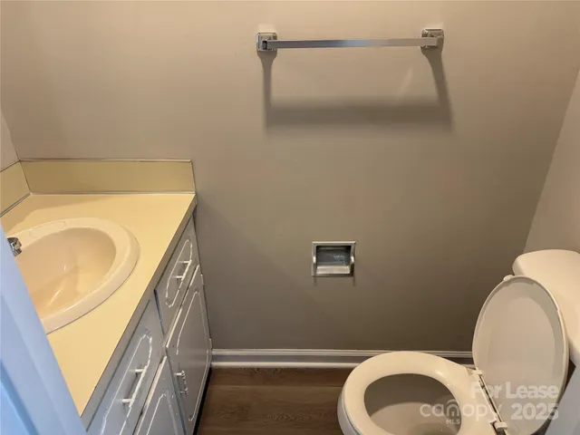 a bathroom with a toilet and a sink