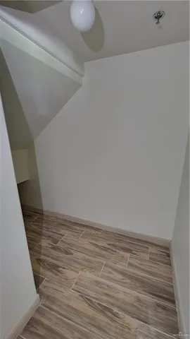 a large kitchen with granite countertop a stove and a sink