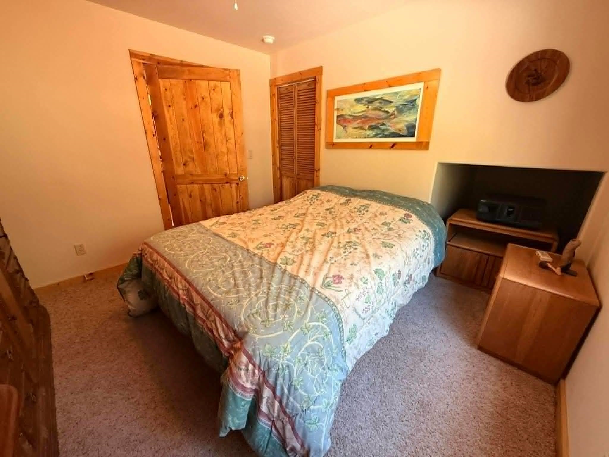 93 Juniper Road Beckwourth, CA 96129 - Photo 16 of 35 a bedroom with a bed and cabinets