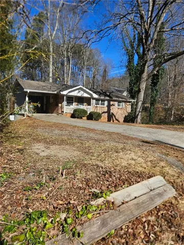 a house with trees in front of it