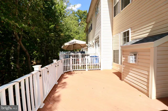 a view of a wooden fence and a porch