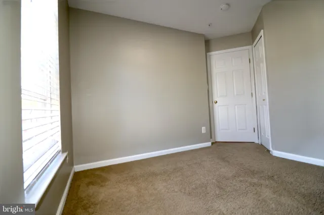 a bathroom with a sink toilet and a mirror