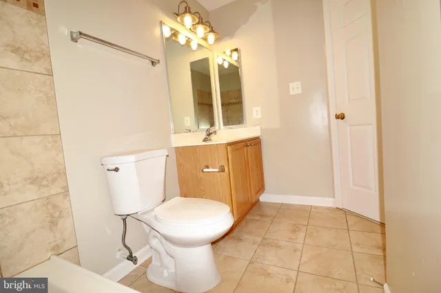 a bathroom with a sink and a large mirror