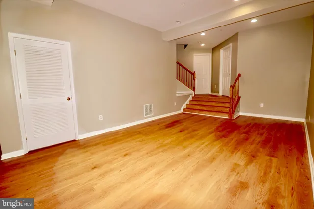 a view of staircase with wooden floor and stairs