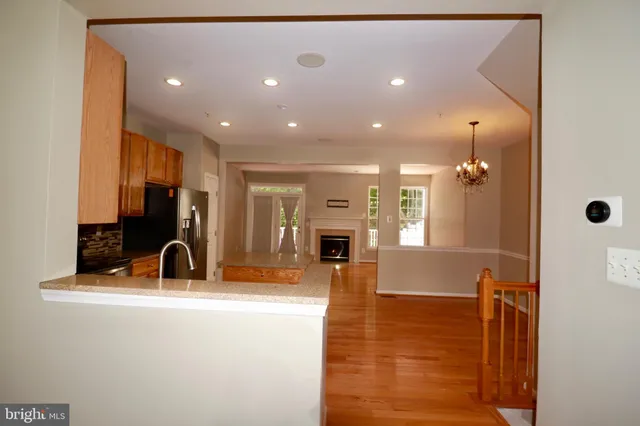 a lobby with furniture and a mirror