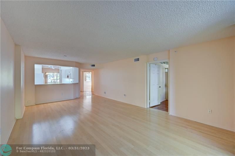 9599 Weldon Circle, Unit A101 Tamarac, FL 33321 - Photo 12 of 28 a view of an empty room with a window