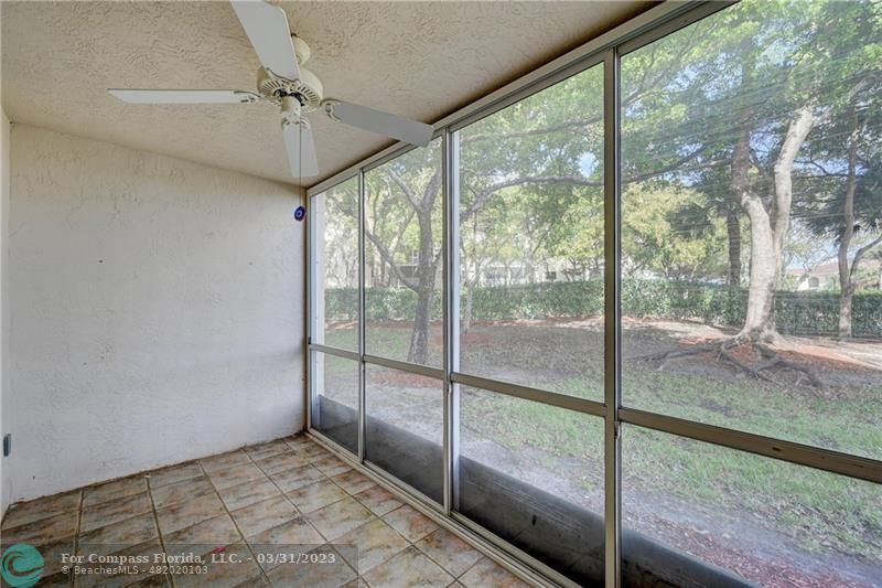 9599 Weldon Circle, Unit A101 Tamarac, FL 33321 - Photo 14 of 28 a view of room with window and a ceiling fan