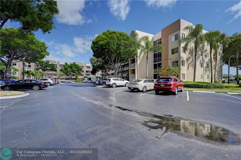 9599 Weldon Circle, Unit A101 Tamarac, FL 33321 - Photo 28 of 28 a view of a street with cars