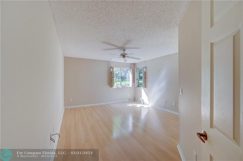 9599 Weldon Circle, Unit A101 Tamarac, FL 33321 - Photo 7 of 28 a view of an empty room with a window