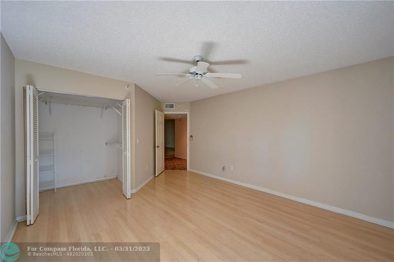 9599 Weldon Circle, Unit A101 Tamarac, FL 33321 - Photo 8 of 28 a view of an empty room with a ceiling fan