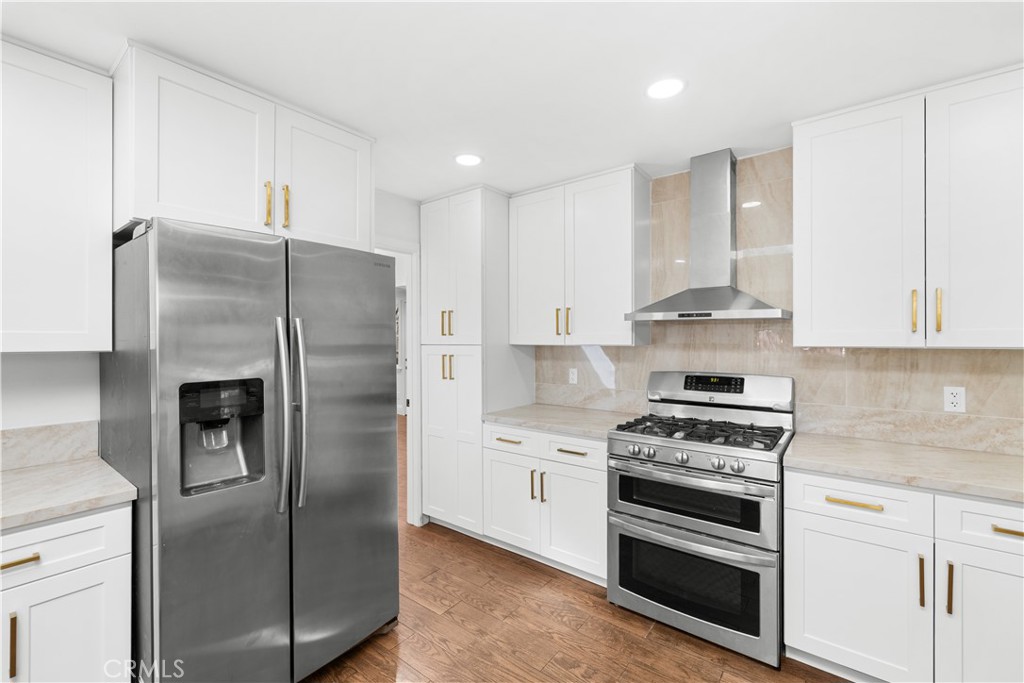 26096 Adamor Road Calabasas, CA 91302 - Photo 24 of 61 Kitchen has full-height cabinets and pantries on both sides of the stove!