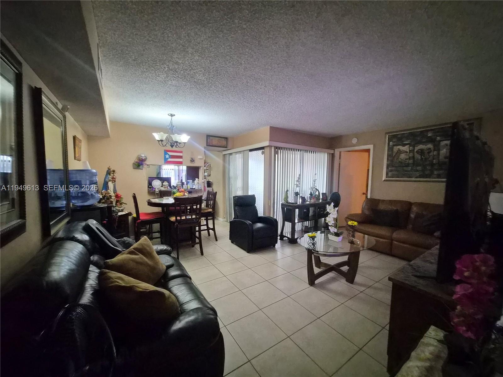800 Independence Drive, Unit 800F Homestead, FL 33034 - Photo 19 of 26 a living room with furniture and a window