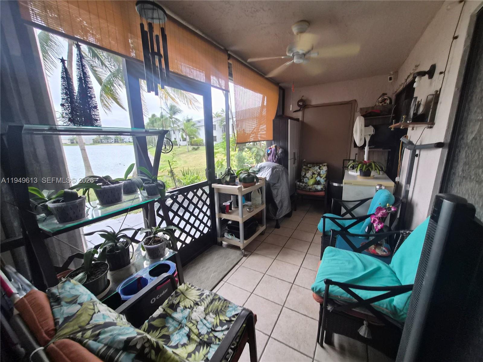 800 Independence Drive, Unit 800F Homestead, FL 33034 - Photo 21 of 26 a living room with furniture fireplace and large windows