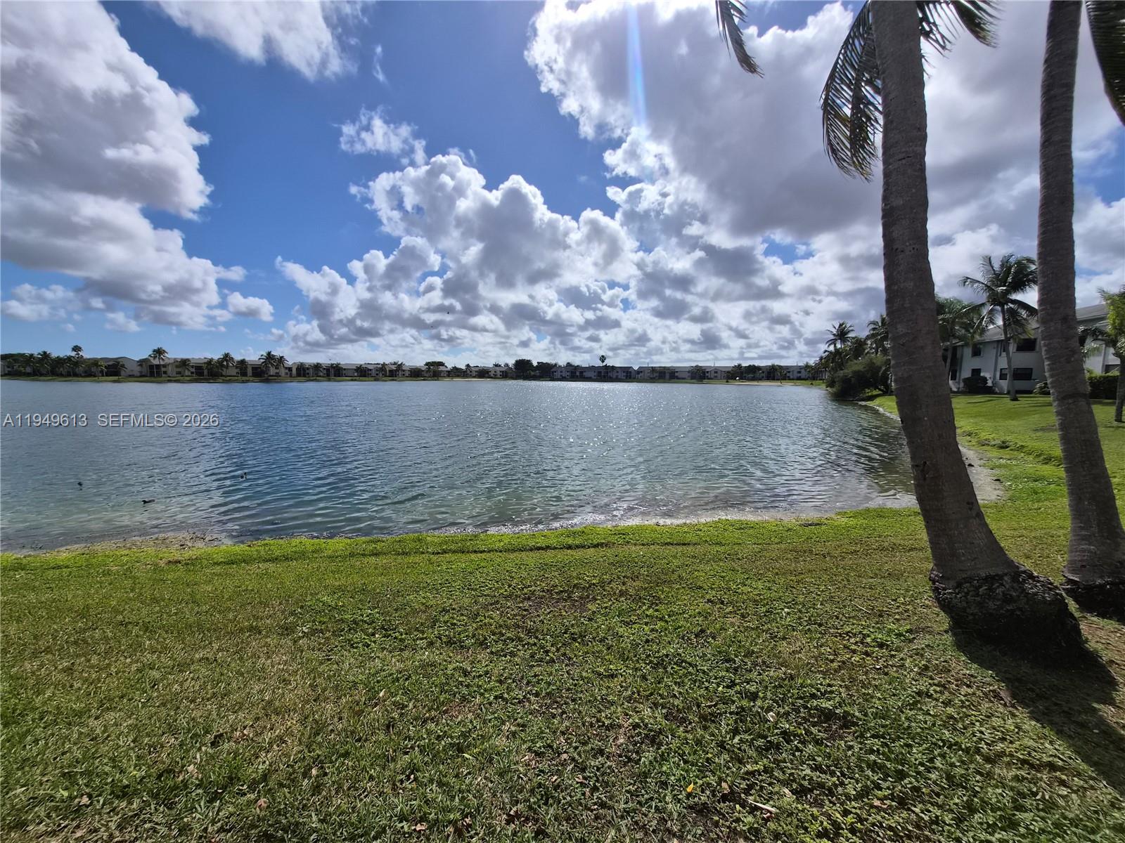 800 Independence Drive, Unit 800F Homestead, FL 33034 - Photo 24 of 26 a view of a lake from a yard