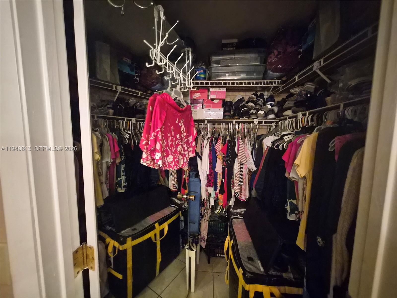 800 Independence Drive, Unit 800F Homestead, FL 33034 - Photo 10 of 26 a view of walk in closet with clothes