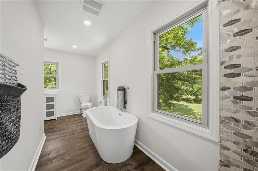 217 Country Club Road Washington, PA 15301 - Photo 21 of 50 Primary suite with full-height shower, soaking tub, and his-and-hers vanity in a luxury Victorian estate near Washington, PA