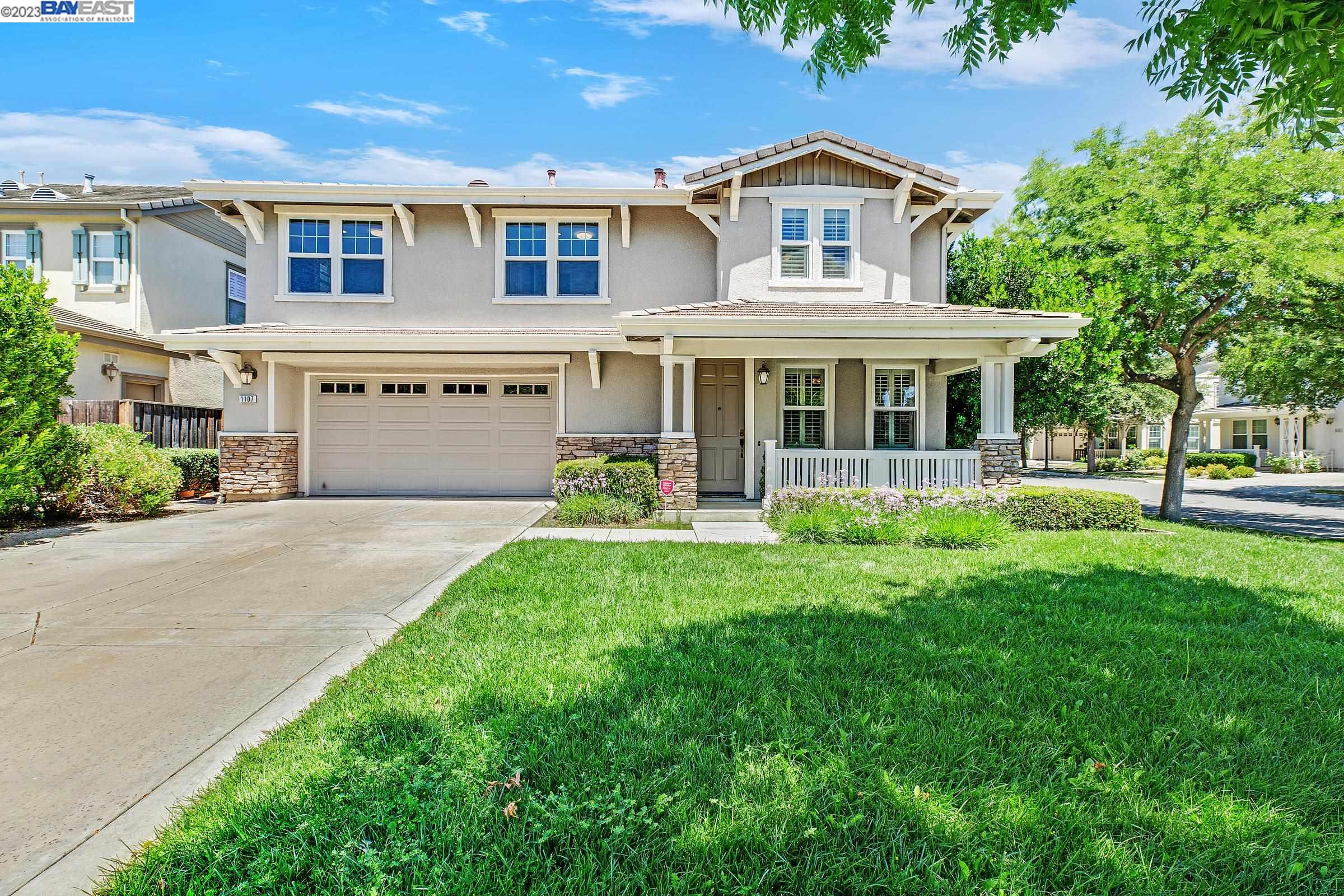 1107 Mills Court Pleasanton, CA 94566 - Photo 1 of 1 a front view of a house with a yard and garage