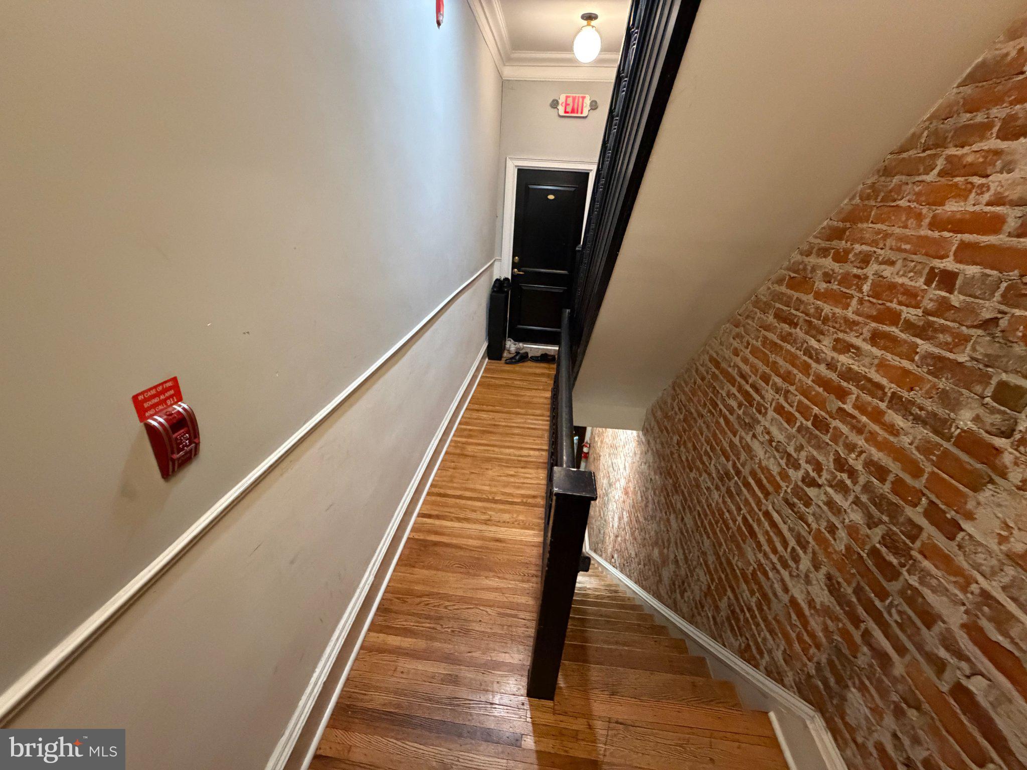 815 South 49th Street Philadelphia, PA 19143 - Photo 25 of 72 Charming staircase with rustic brick wall.