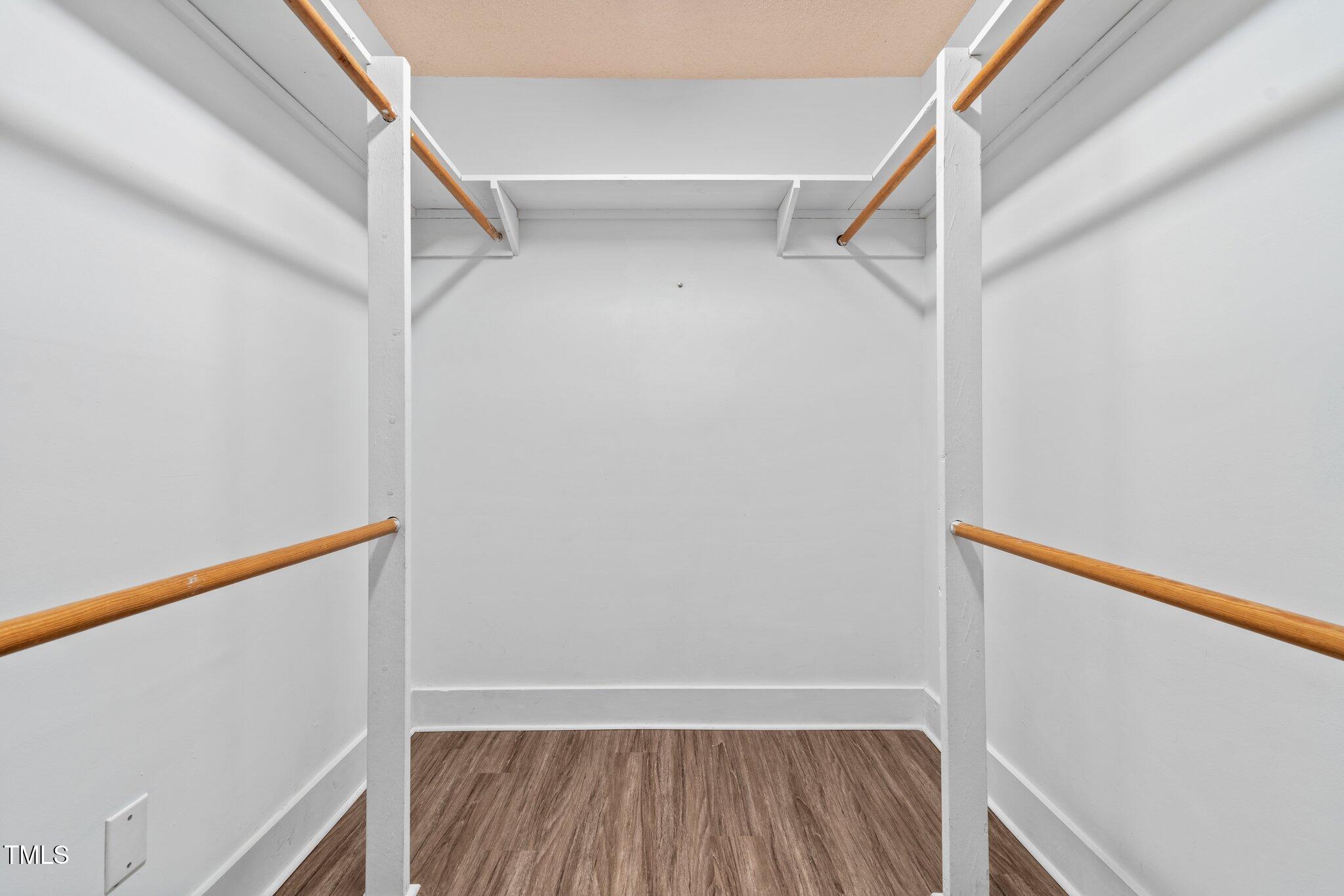 578 Marler Road Benson, NC 27504 - Photo 15 of 55 a view of walk in closet with empty racks