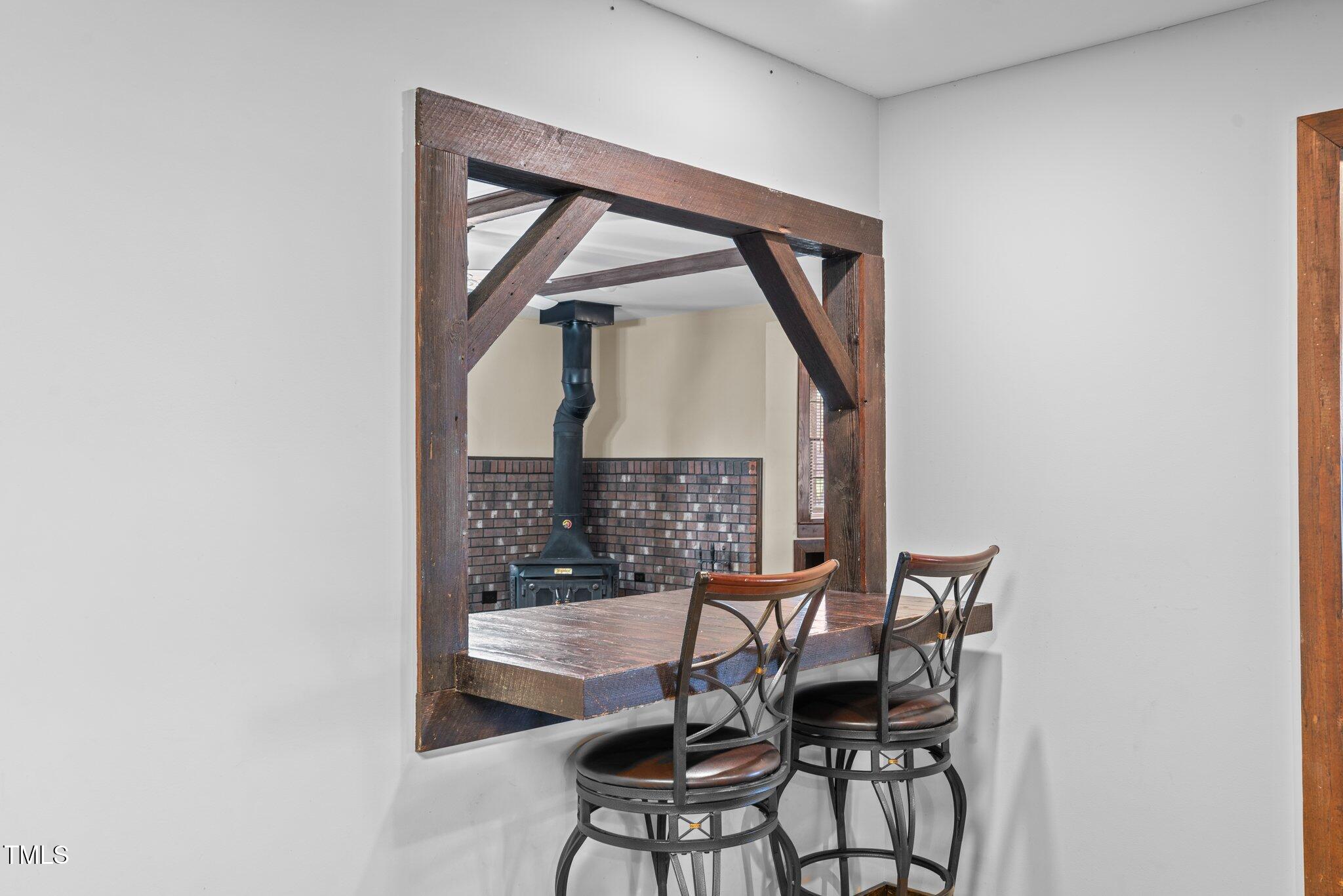 578 Marler Road Benson, NC 27504 - Photo 21 of 55 a view of a room with a table and chairs