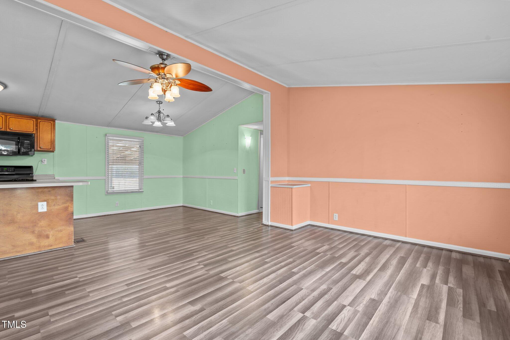 578 Marler Road Benson, NC 27504 - Photo 36 of 55 a view of empty room with wooden floor and fan