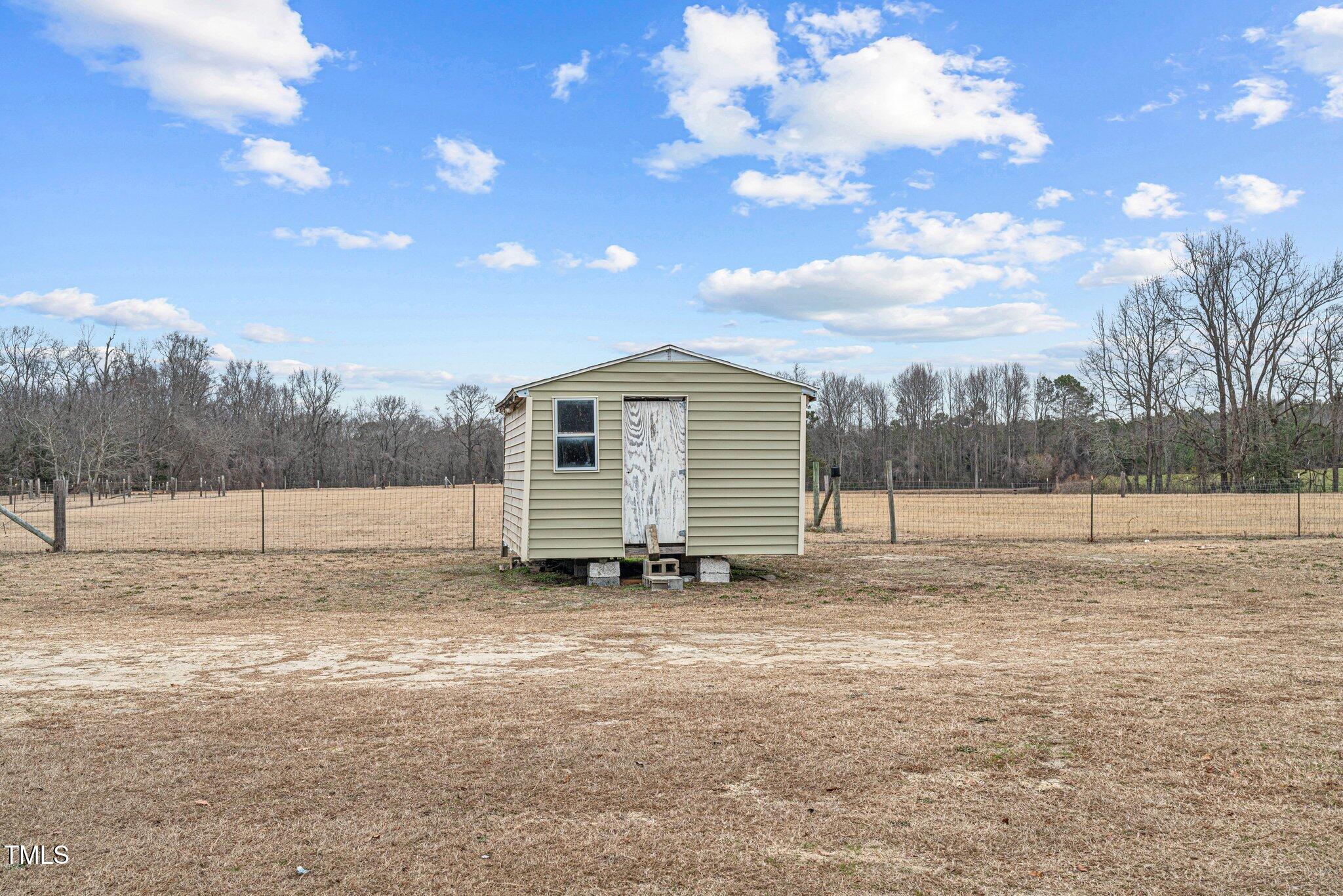 578 Marler Road Benson, NC 27504 - Photo 44 of 55 a view of a house with a yard