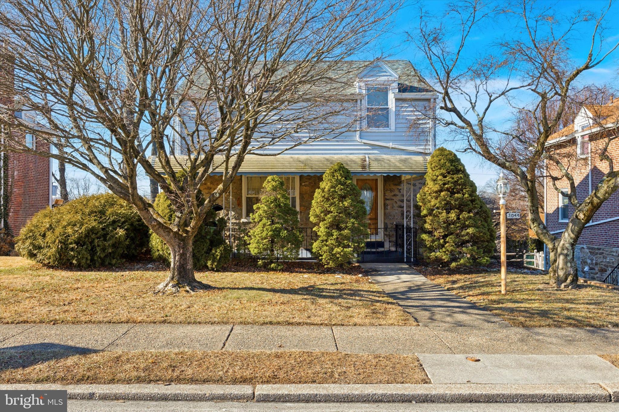 2044 Jenkintown Road Glenside, PA 19038 - Photo 1 of 33 a front view of a house with garden