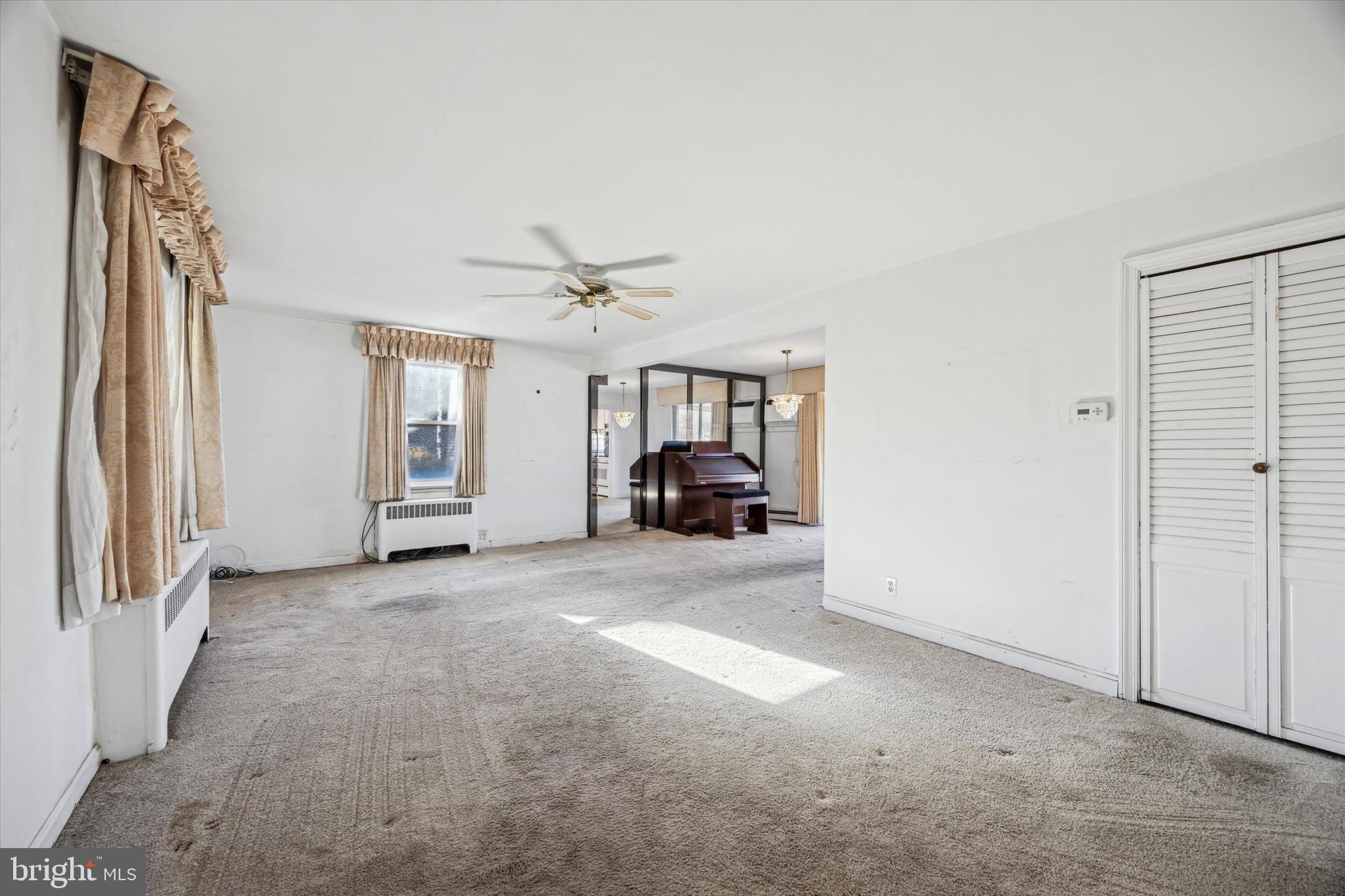 2044 Jenkintown Road Glenside, PA 19038 - Photo 11 of 33 a view of a livingroom with furniture and chandelier fan