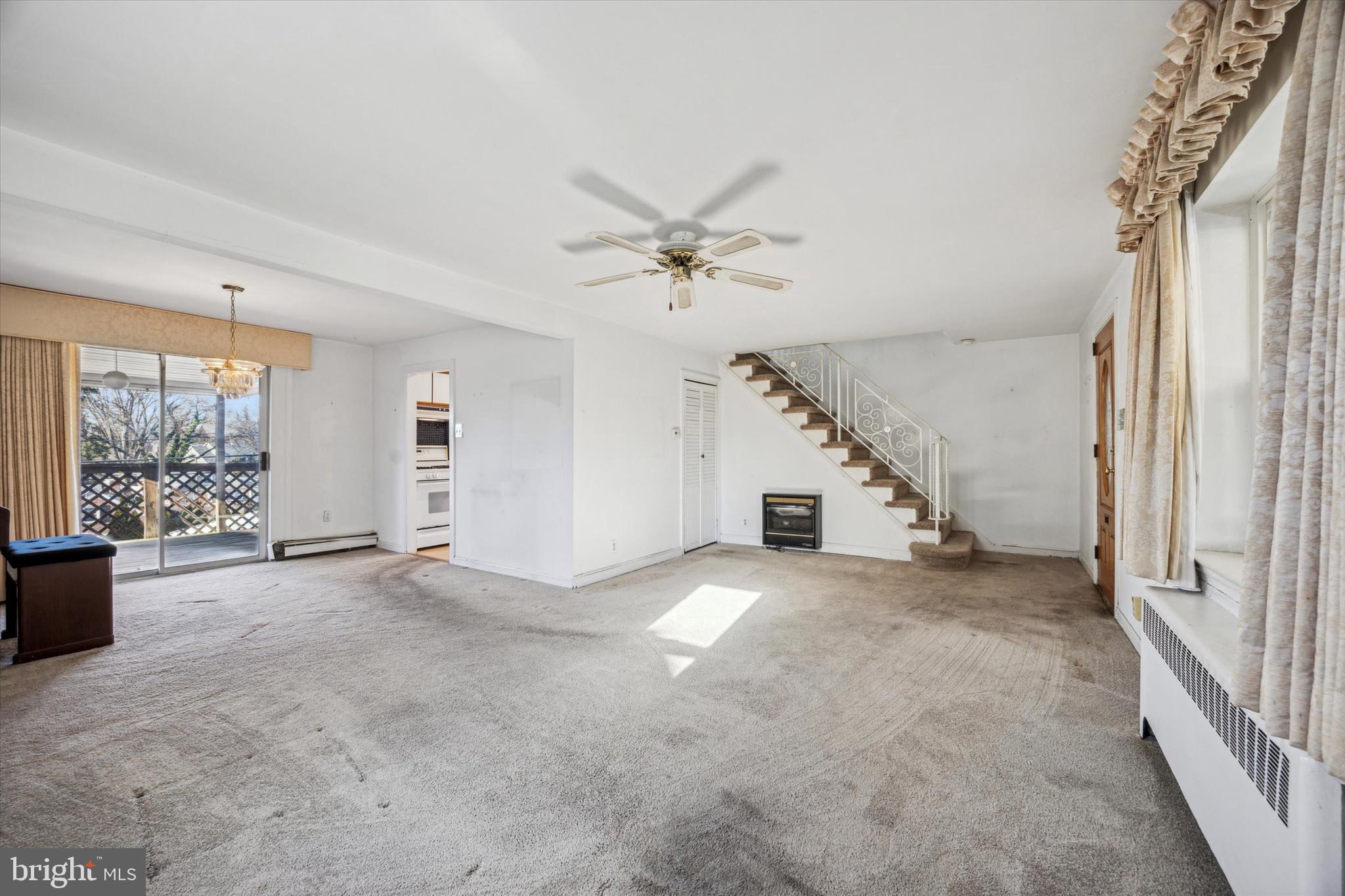 2044 Jenkintown Road Glenside, PA 19038 - Photo 9 of 33 an empty room with windows and ceiling fan