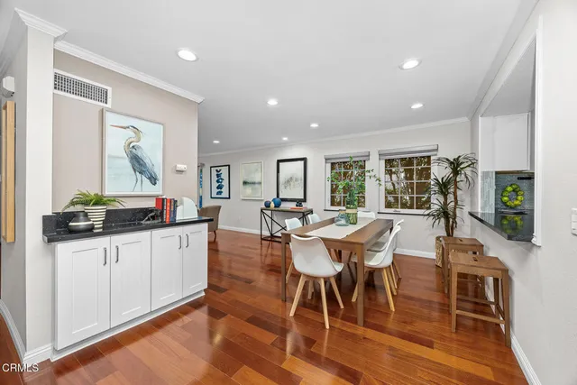 a large kitchen with granite countertop a stove sink and cabinets
