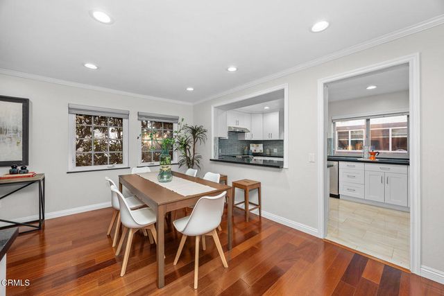 a kitchen with counter top space and center island stainless steel appliances