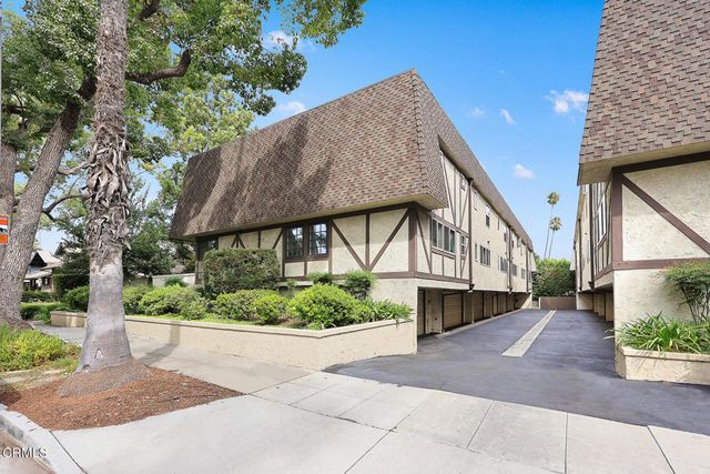 a view of a house with a small yard